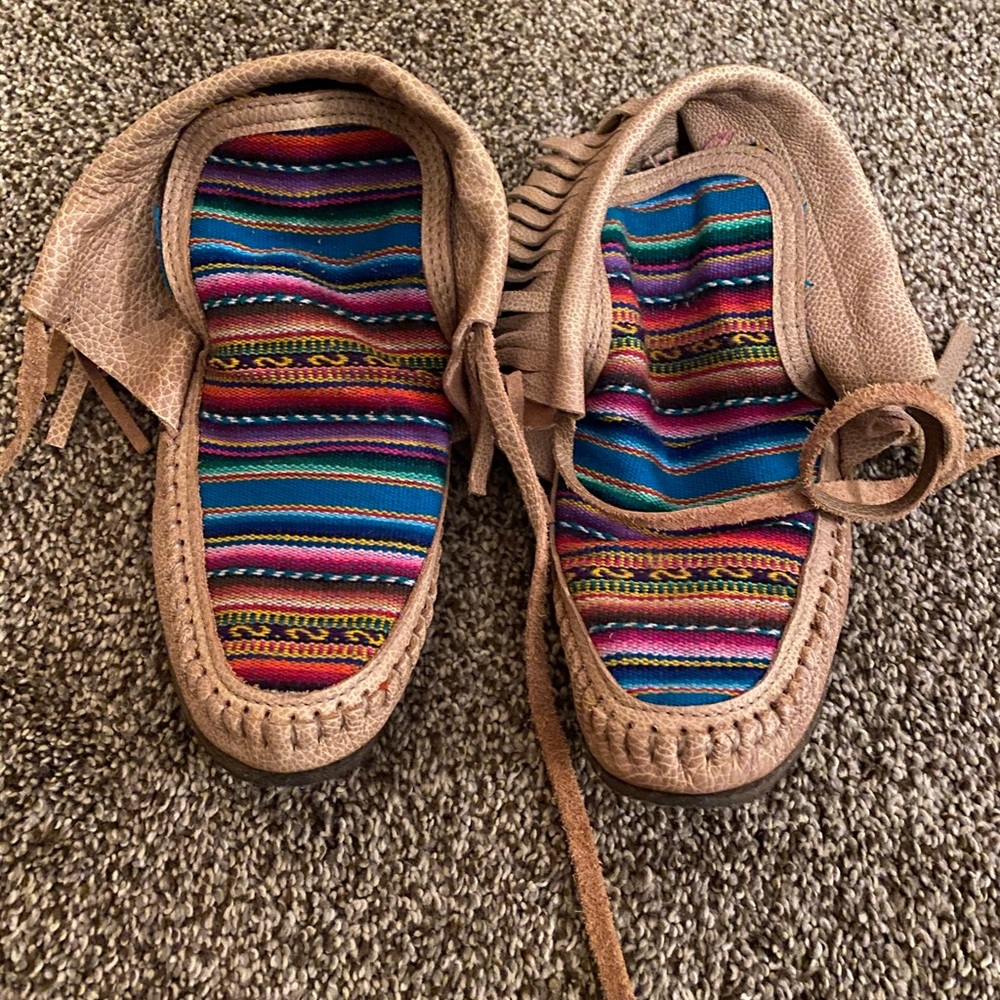 Leather serape fringe moccasins.